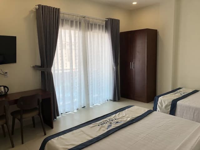 Victory Airport Hotel-Deluxe Quadruple Room, Multiple Beds, Balcony-1