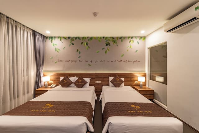 Thanh Long Hotel-Family Triple Room-6