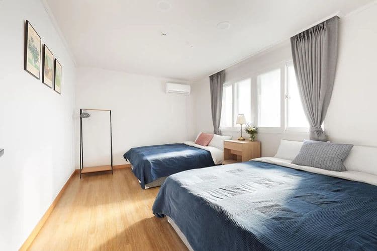 Bedroom5: two queen beds, a dressing table, clothes hanger