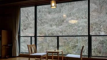 View from the wide edge on the mountain stream side of the new building around winter