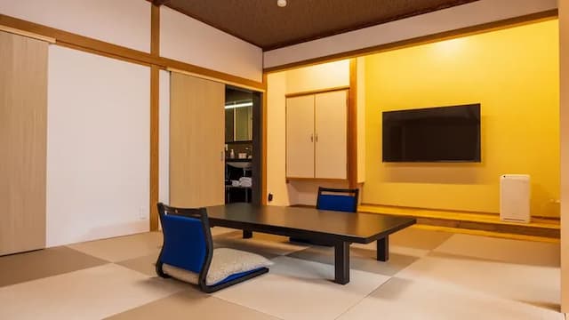 Japanese-style room with 12 tatami mats, twin bed and a bed. *This room type is located on the second floor of the building.
