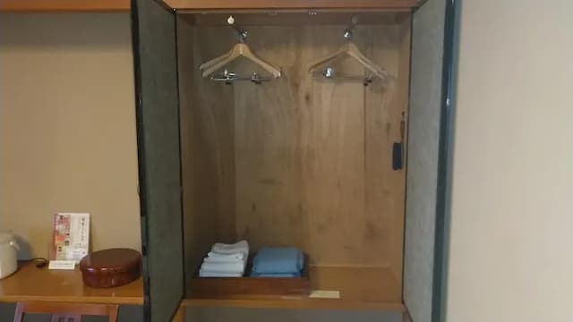 Japanese room closet. Stores hangers, jinbei, and towels.