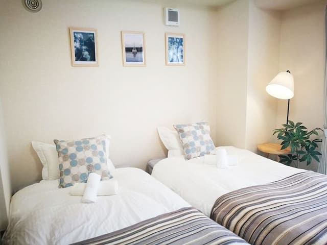 2 single beds can combine into a King sized bed. Please request us upon room booking.