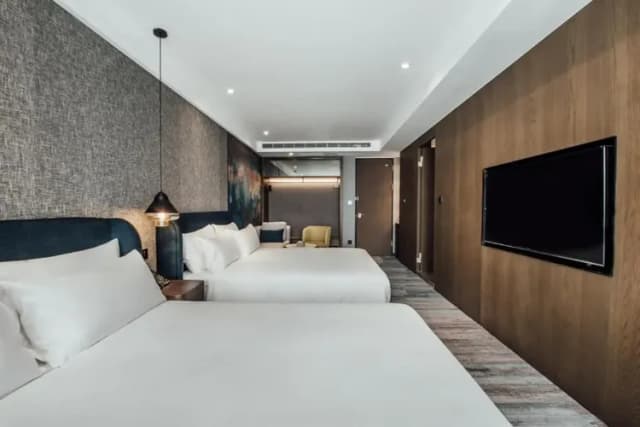 【High Speed Rail Holiday】2-day free travel at Kaohsiung Junyi Hotel-Deluxe Quad (Breakfast included)(July-September)-1